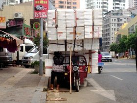 Balancing act: Some passing motorists actually stopped to take photos while others kept their distance in case the boxes came tumbling down on to their cars