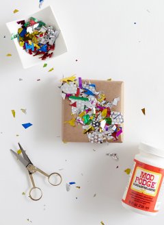 Confetti Glued To Plain Brown Wrapping Paper
