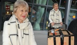 Dame Helen Mirren at Heathrow airport yesterday