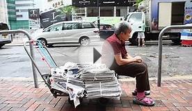 Collecting for rent in pricey Hong Kong, one cardboard box