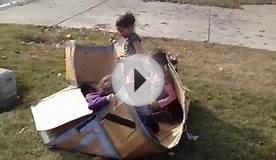 Kids playing with Cardboard box