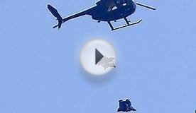 Skydiver lands in cardboard boxes